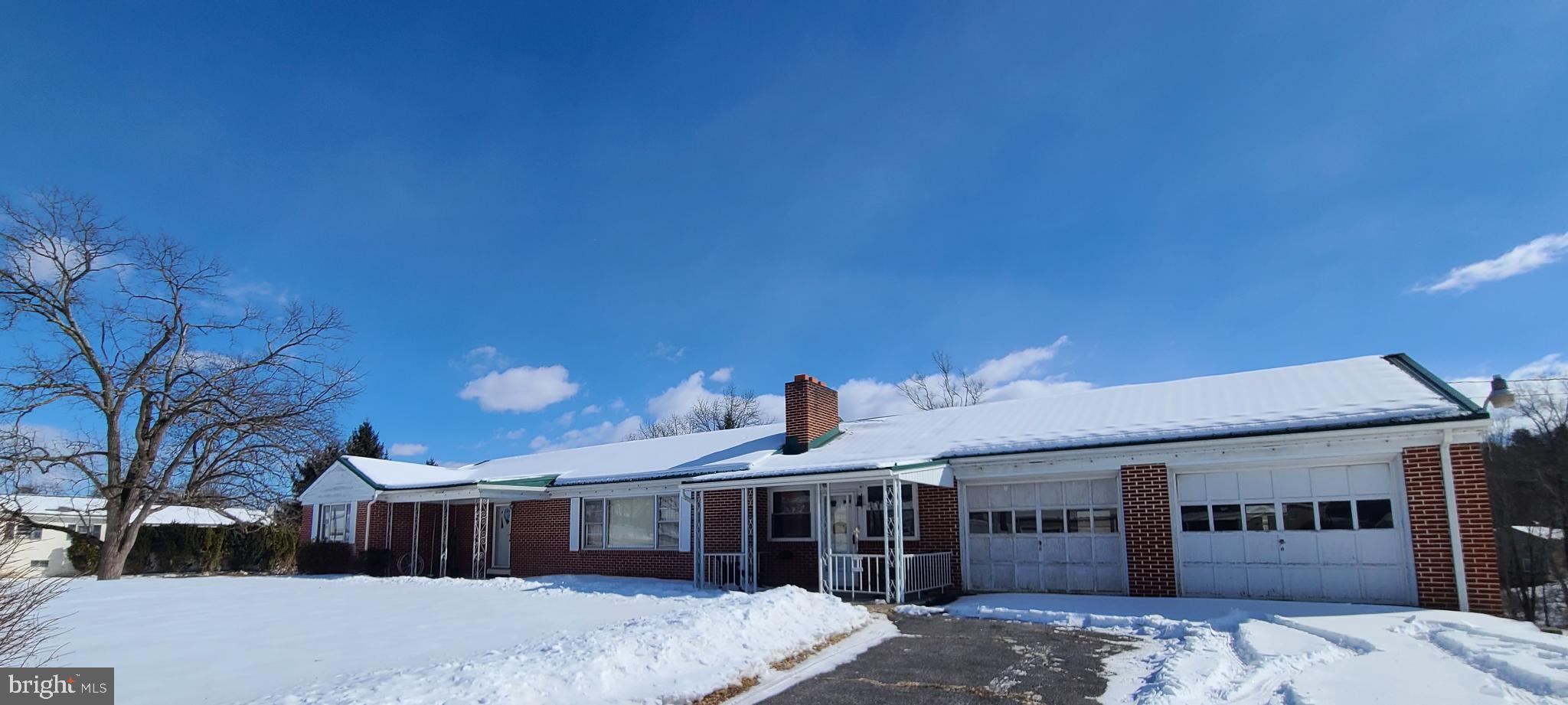 6821 Spring Road Shermans Dale, PA 17090 - Photo 2 of 11 Charming brick home under a winter sky.