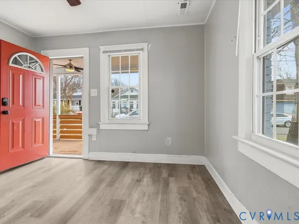 a view of empty room with windows