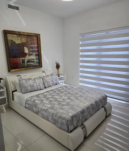 a bathroom with a toilet a sink and a shower