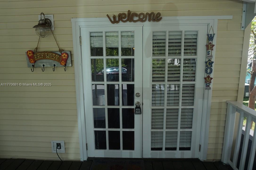 11 Old State Road Key Largo, FL 33037 - Photo 15 of 100 a front view of a house with a window