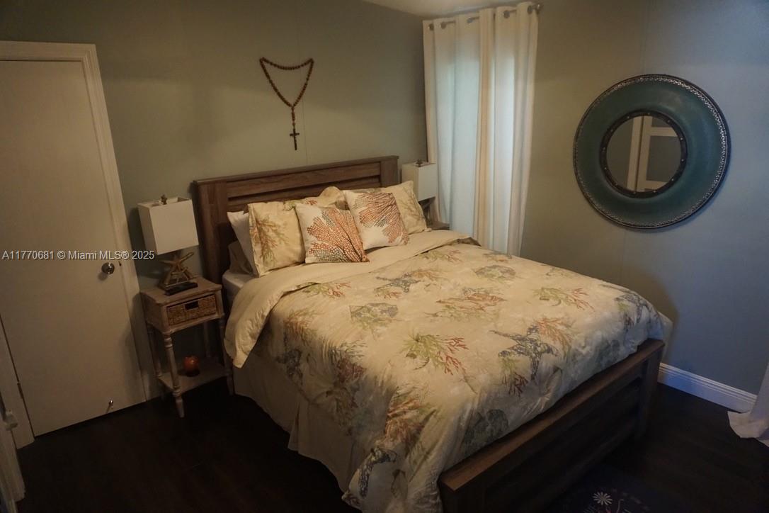 11 Old State Road Key Largo, FL 33037 - Photo 36 of 100 a bed sitting in a bedroom next to a window