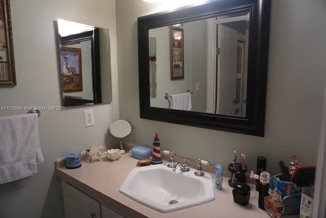 a kitchen with cabinets appliances a sink and a counter top
