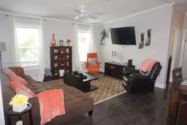 a view of ocean with boats and trees in the background