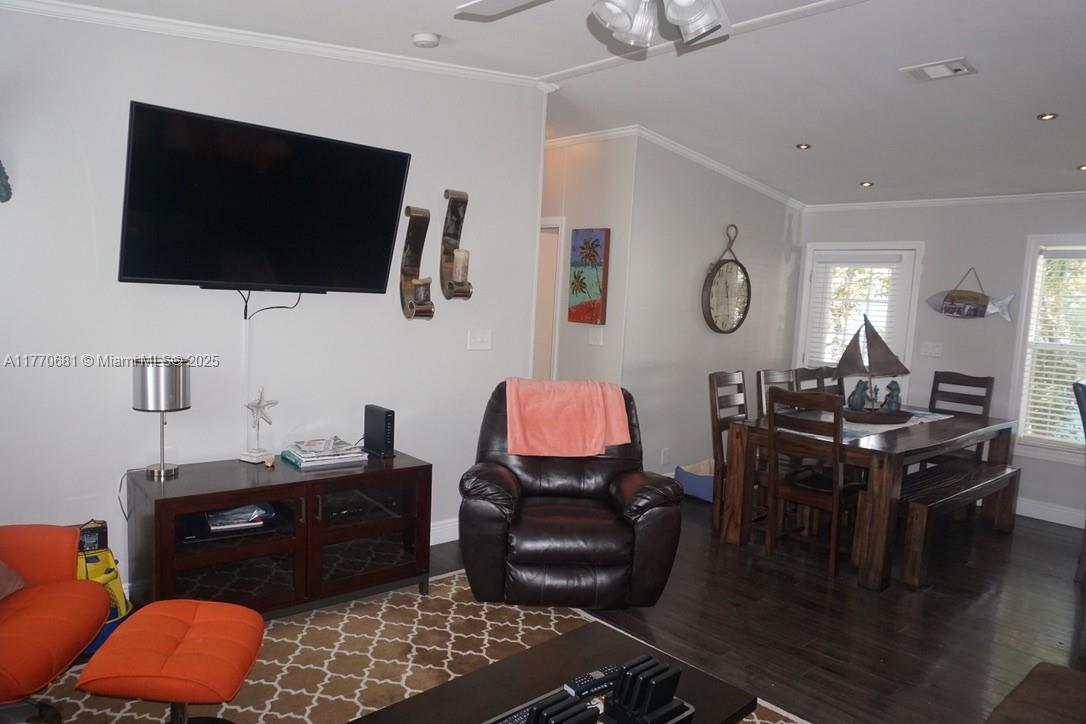11 Old State Road Key Largo, FL 33037 - Photo 49 of 100 a living room with furniture and a flat screen tv