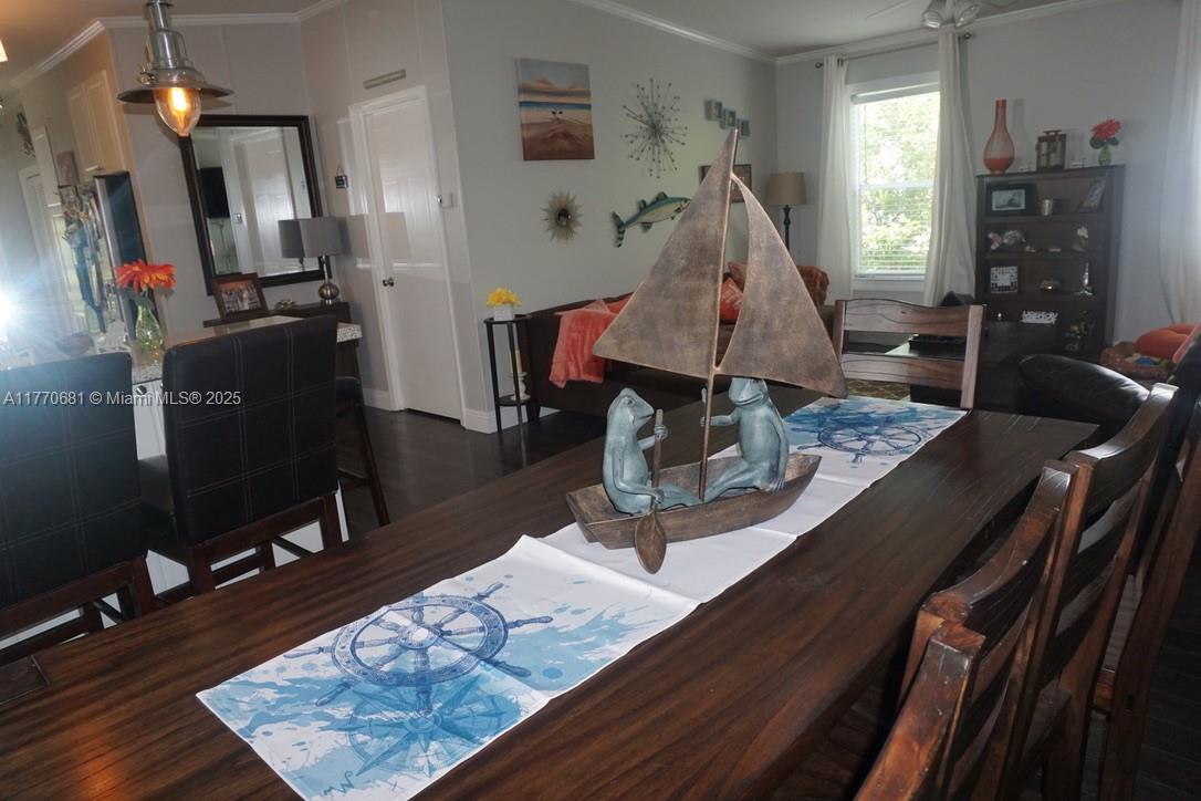 11 Old State Road Key Largo, FL 33037 - Photo 52 of 100 a living room with furniture and wooden floor