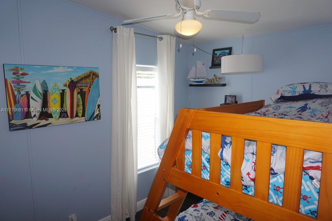 11 Old State Road Key Largo, FL 33037 - Photo 60 of 100 a bedroom with a bed and a window