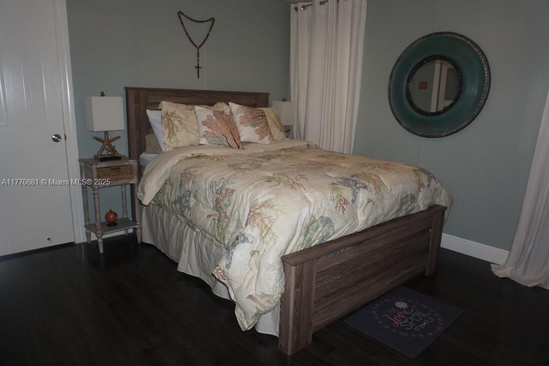 11 Old State Road Key Largo, FL 33037 - Photo 67 of 100 a bed sitting in a bedroom next to a window