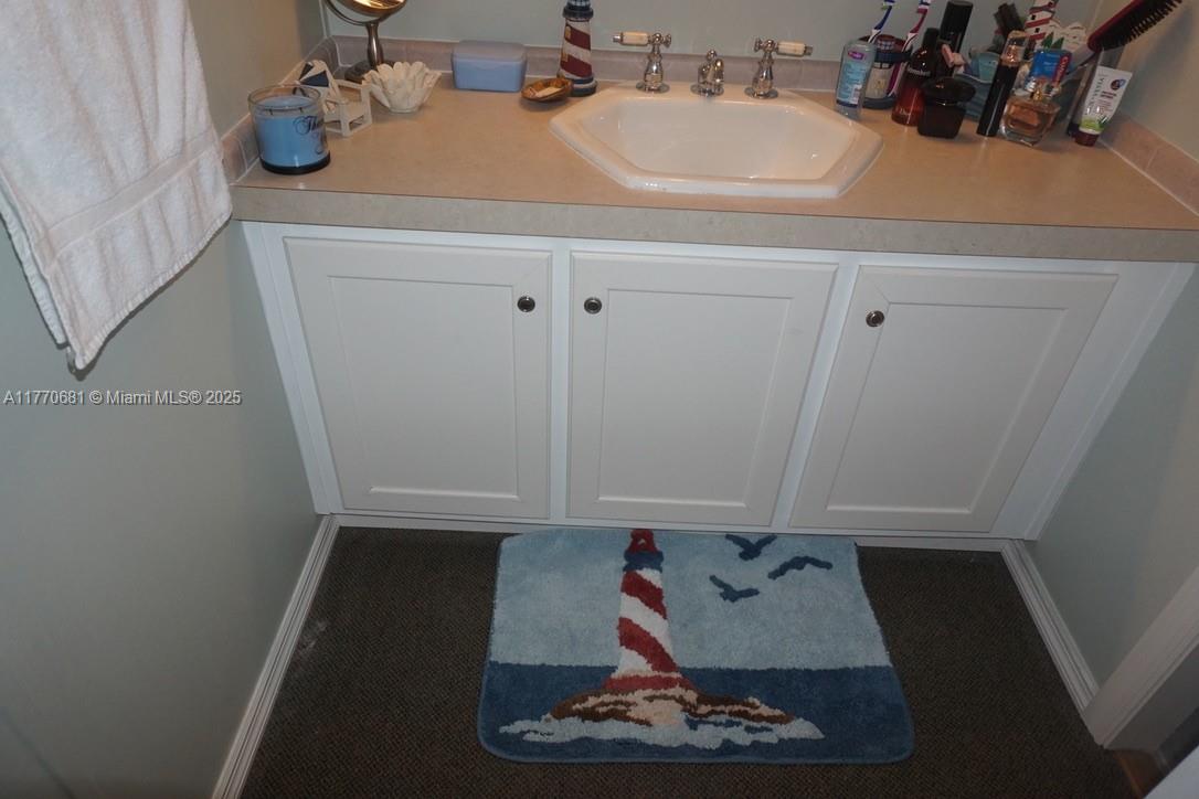 11 Old State Road Key Largo, FL 33037 - Photo 73 of 100 a bathroom with a sink and a mirror