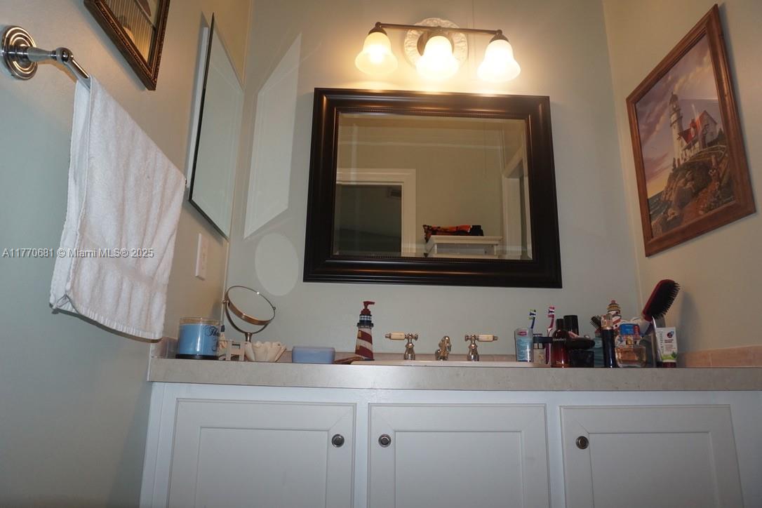 11 Old State Road Key Largo, FL 33037 - Photo 74 of 100 a bathroom with a sink and a mirror
