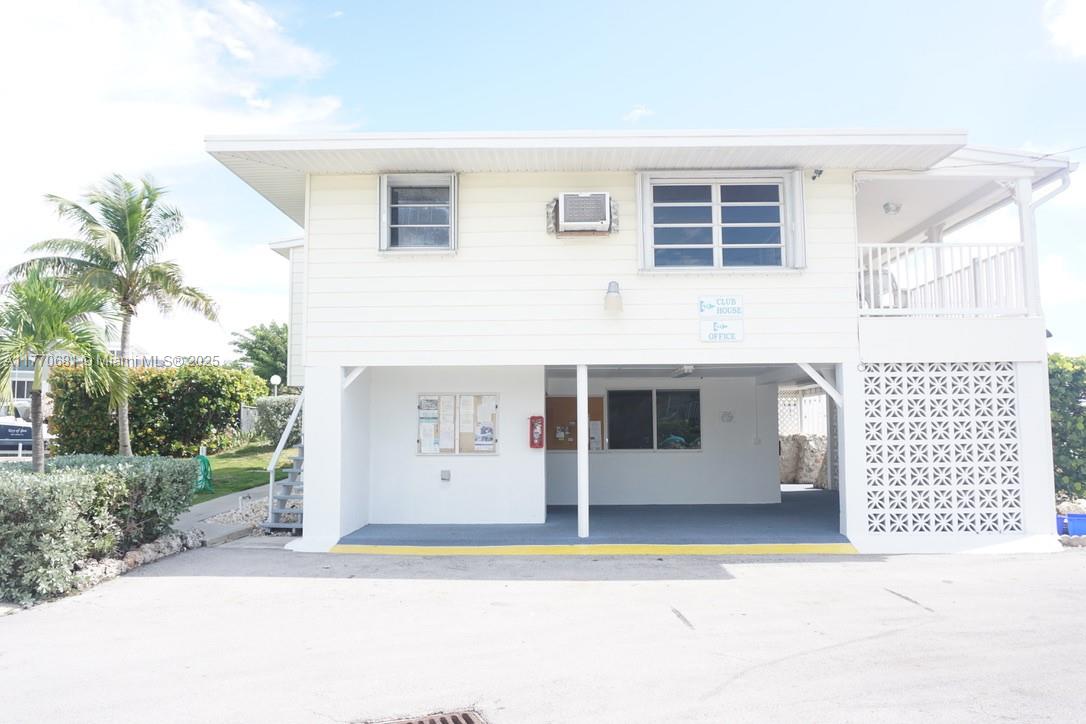 11 Old State Road Key Largo, FL 33037 - Photo 85 of 100 a front view of a house with a garden
