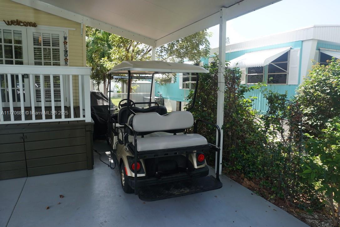 11 Old State Road Key Largo, FL 33037 - Photo 9 of 100 a view of a patio with a table and chairs and potted plants