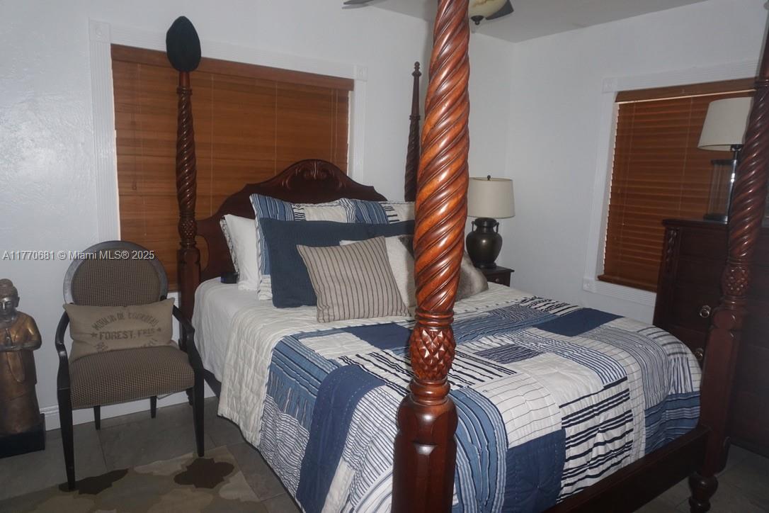 11 Old State Road Key Largo, FL 33037 - Photo 96 of 100 a bed sitting in a bedroom next to a window