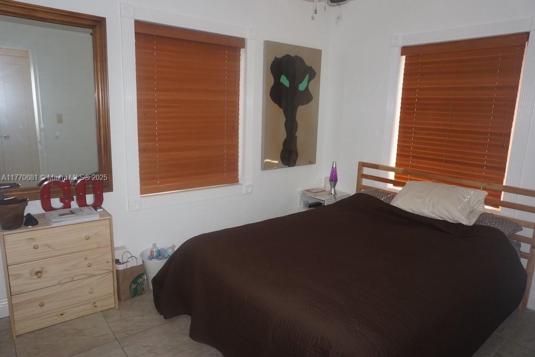 11 Old State Road Key Largo, FL 33037 - Photo 97 of 100 a bedroom with a bed and a dresser