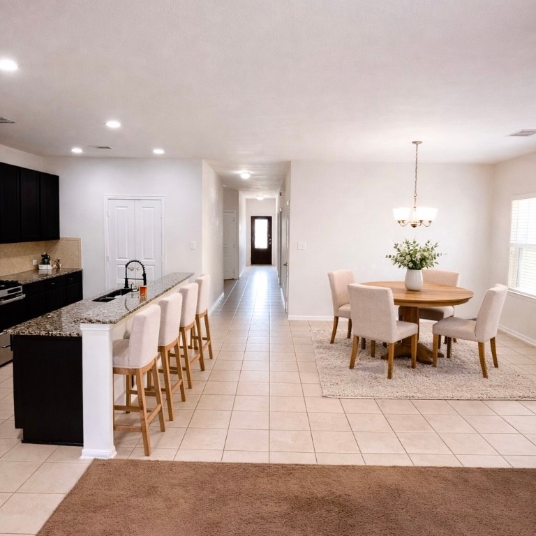 8626 Willet Street Baytown, TX 77521 - Photo 16 of 29 a view of a dining room with furniture