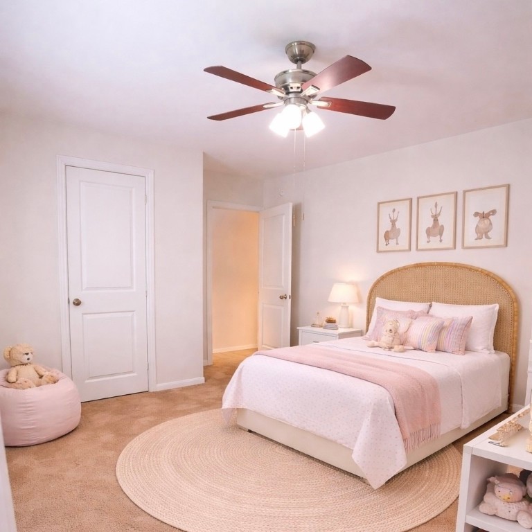 8626 Willet Street Baytown, TX 77521 - Photo 22 of 29 a bedroom with a bed and ceiling fan