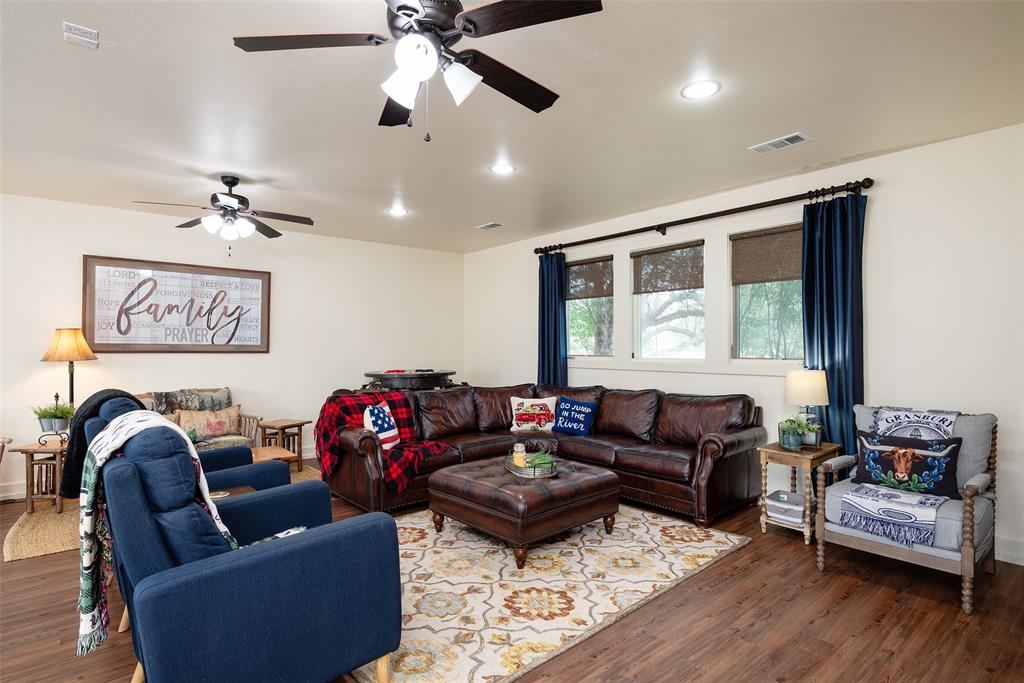 2312 Cactus Rio Lane Weatherford, TX 76087 - Photo 27 of 37 a living room with furniture ceiling fan and a window