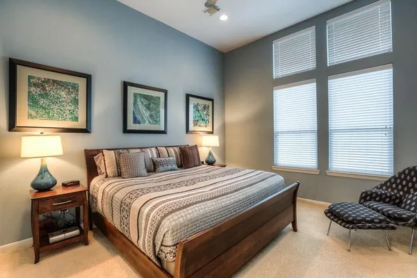 a bedroom with bed and a window