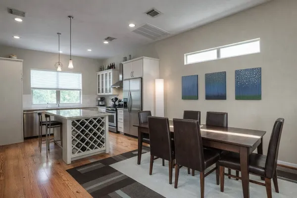 a view of a dining room with furniture window and wooden floor