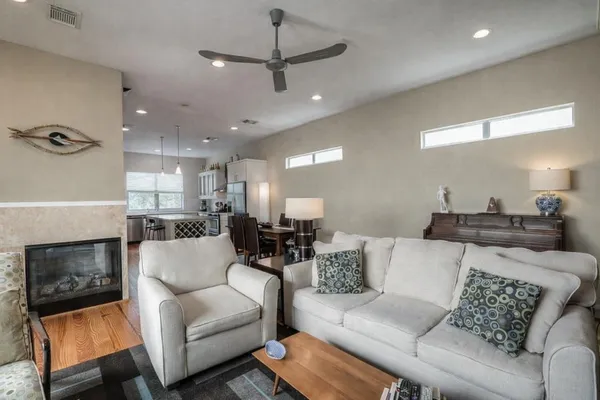 a living room with furniture and a fireplace