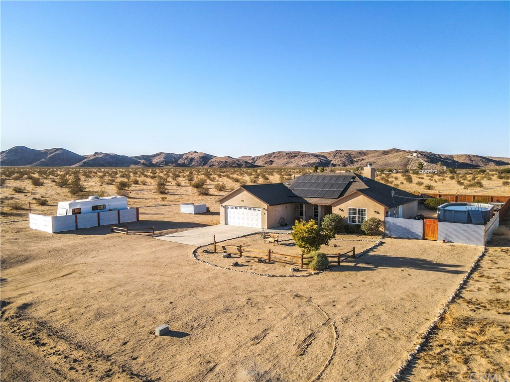 64184 Sun Mesa Road Joshua Tree, CA 92252 - Photo 1 of 1 a view of a terrace with chairs
