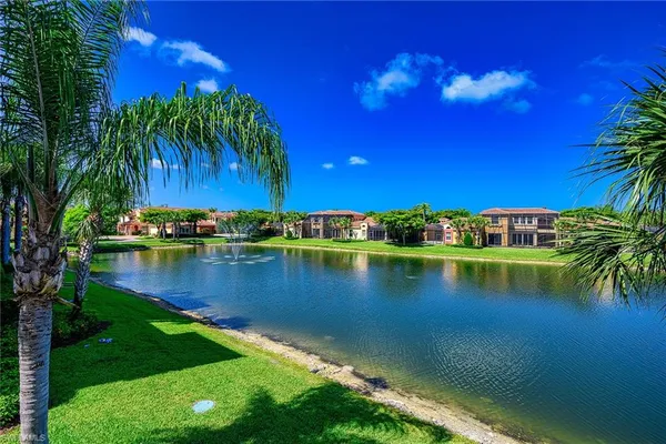 a view of a lake with a house in the background
