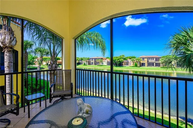 a view of a chairs and table in the balcony