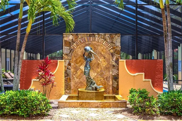 a view of swimming pool with sitting area