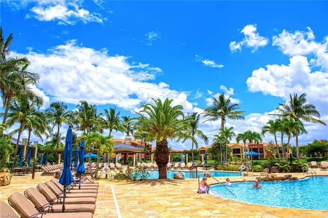 a view of a swimming pool with a table and chairs