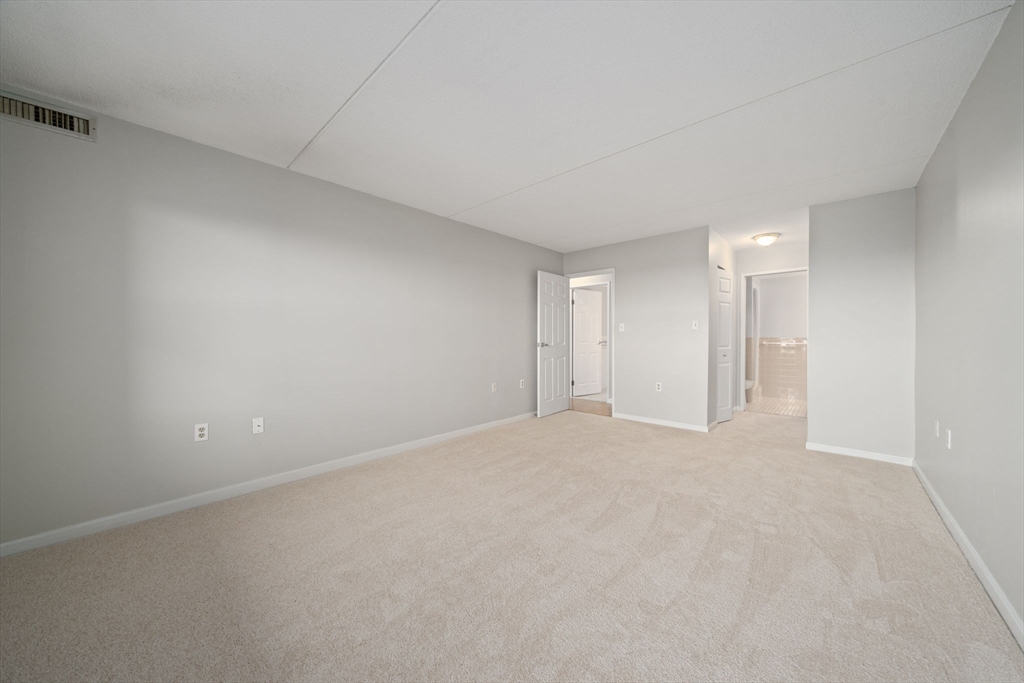 155 George Washington Boulevard, Unit 402 Hull, MA 02045 - Photo 14 of 42 a view of an empty room