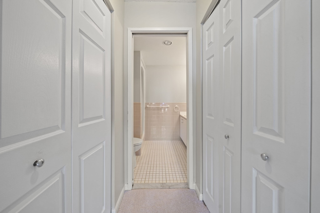 155 George Washington Boulevard, Unit 402 Hull, MA 02045 - Photo 15 of 42 a view of a bathroom from a hallway