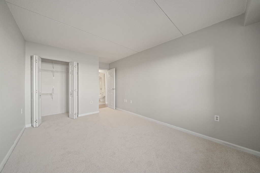 155 George Washington Boulevard, Unit 402 Hull, MA 02045 - Photo 18 of 42 a view of an empty room