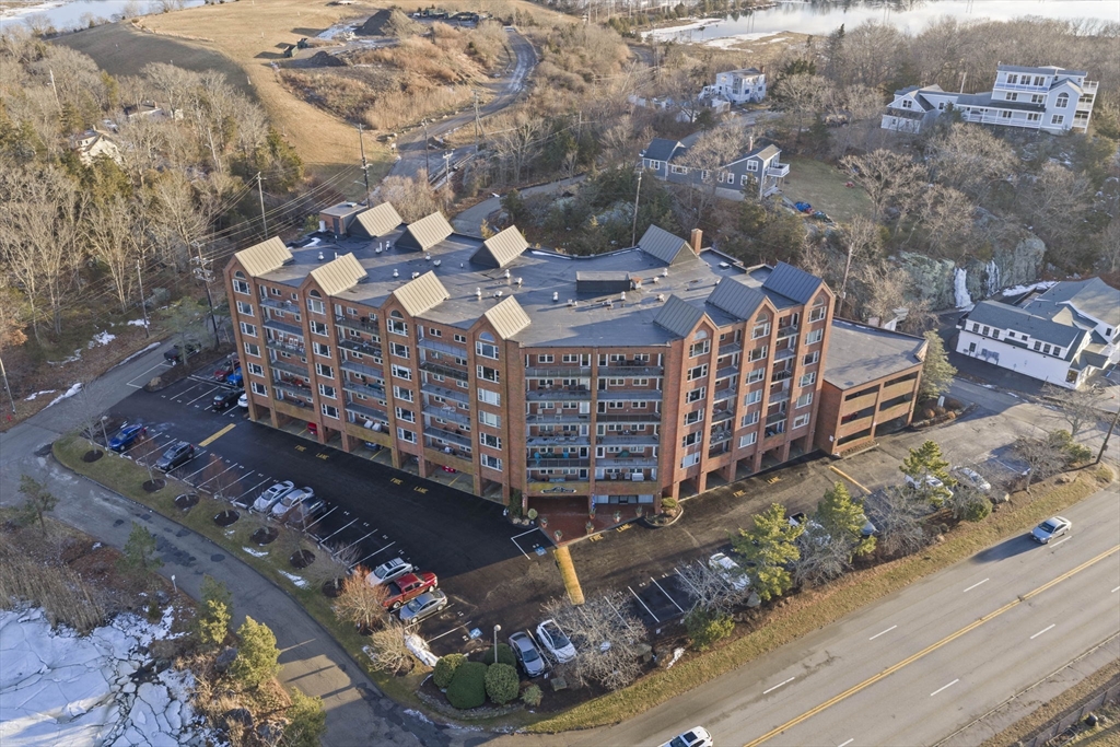155 George Washington Boulevard, Unit 402 Hull, MA 02045 - Photo 23 of 42 a large building with a outdoor space
