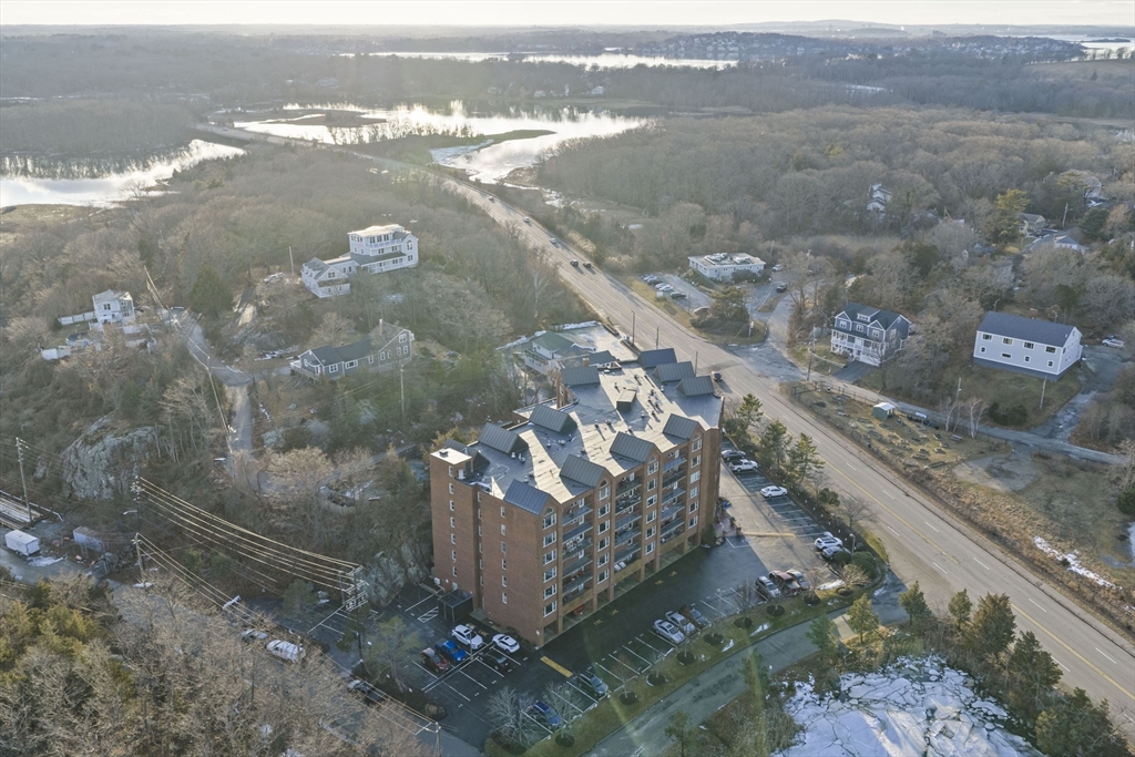 155 George Washington Boulevard, Unit 402 Hull, MA 02045 - Photo 25 of 42 a view of a lake from a yard