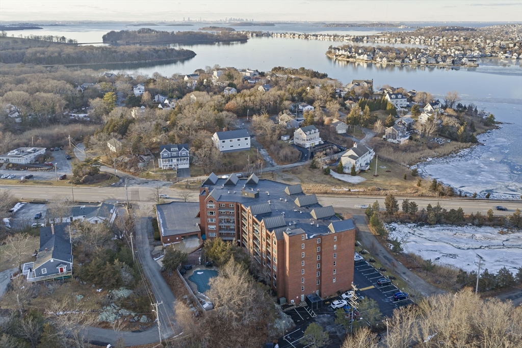 155 George Washington Boulevard, Unit 402 Hull, MA 02045 - Photo 26 of 42 an aerial view of a houses with outdoor space
