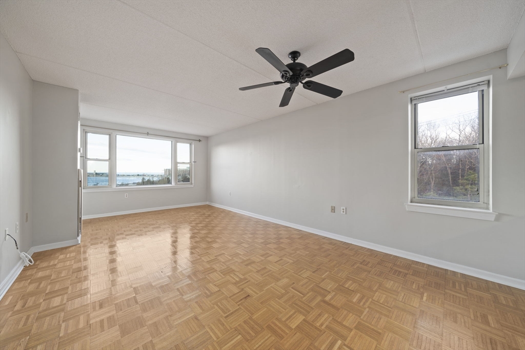 155 George Washington Boulevard, Unit 402 Hull, MA 02045 - Photo 8 of 42 a view of an empty room and window