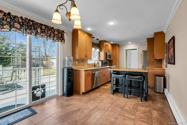 a kitchen with a sink cabinets and window