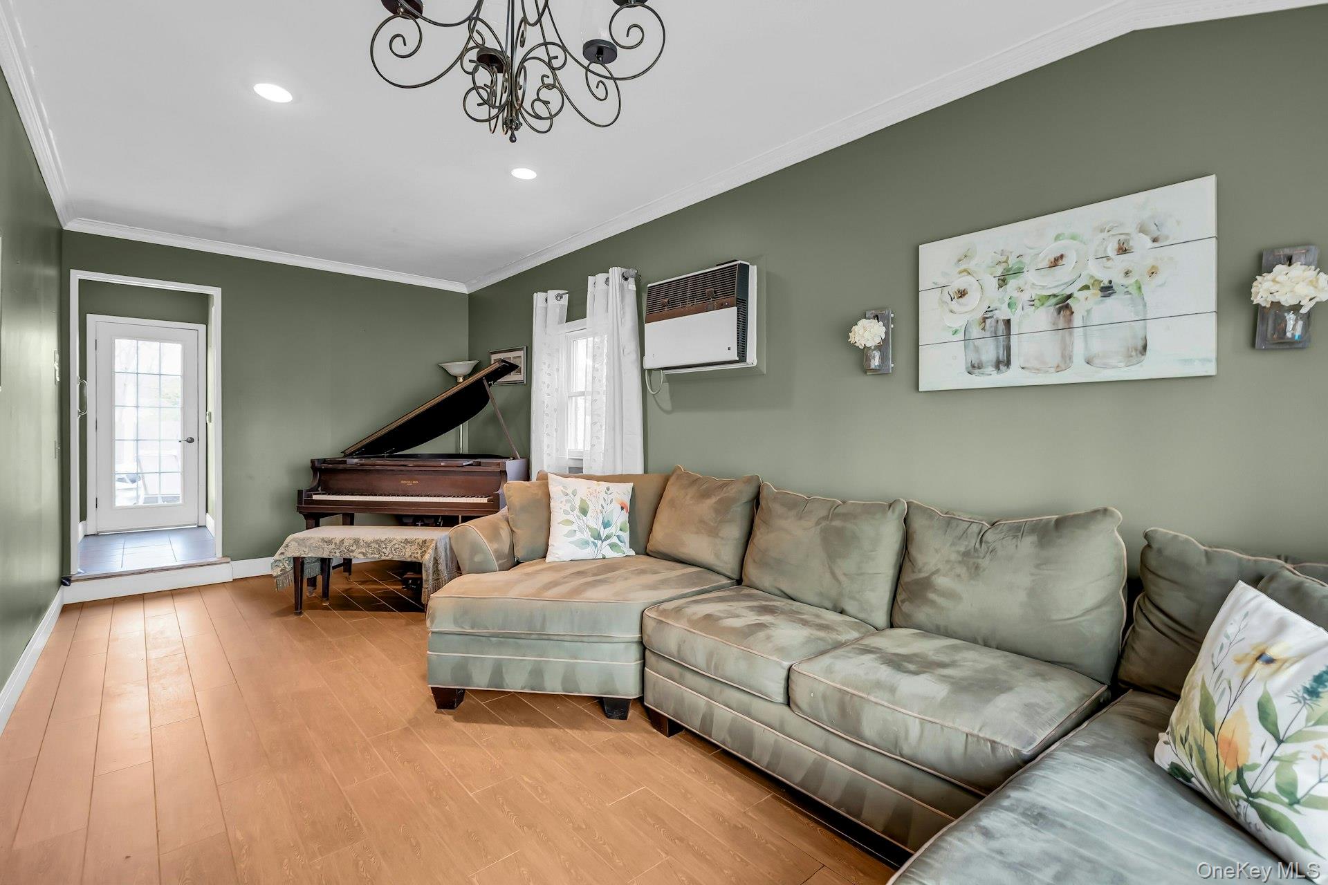 358 Rider Avenue Patchogue, NY 11772 - Photo 8 of 25 Living area with wood finished floors, crown molding, a chandelier, and recessed lighting