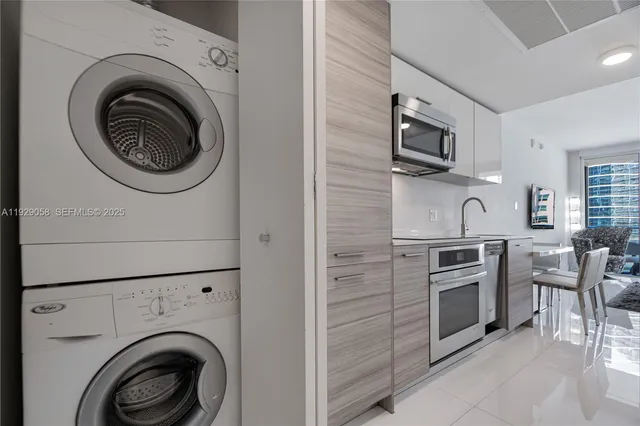 a view of kitchen sink microwave and stove top oven