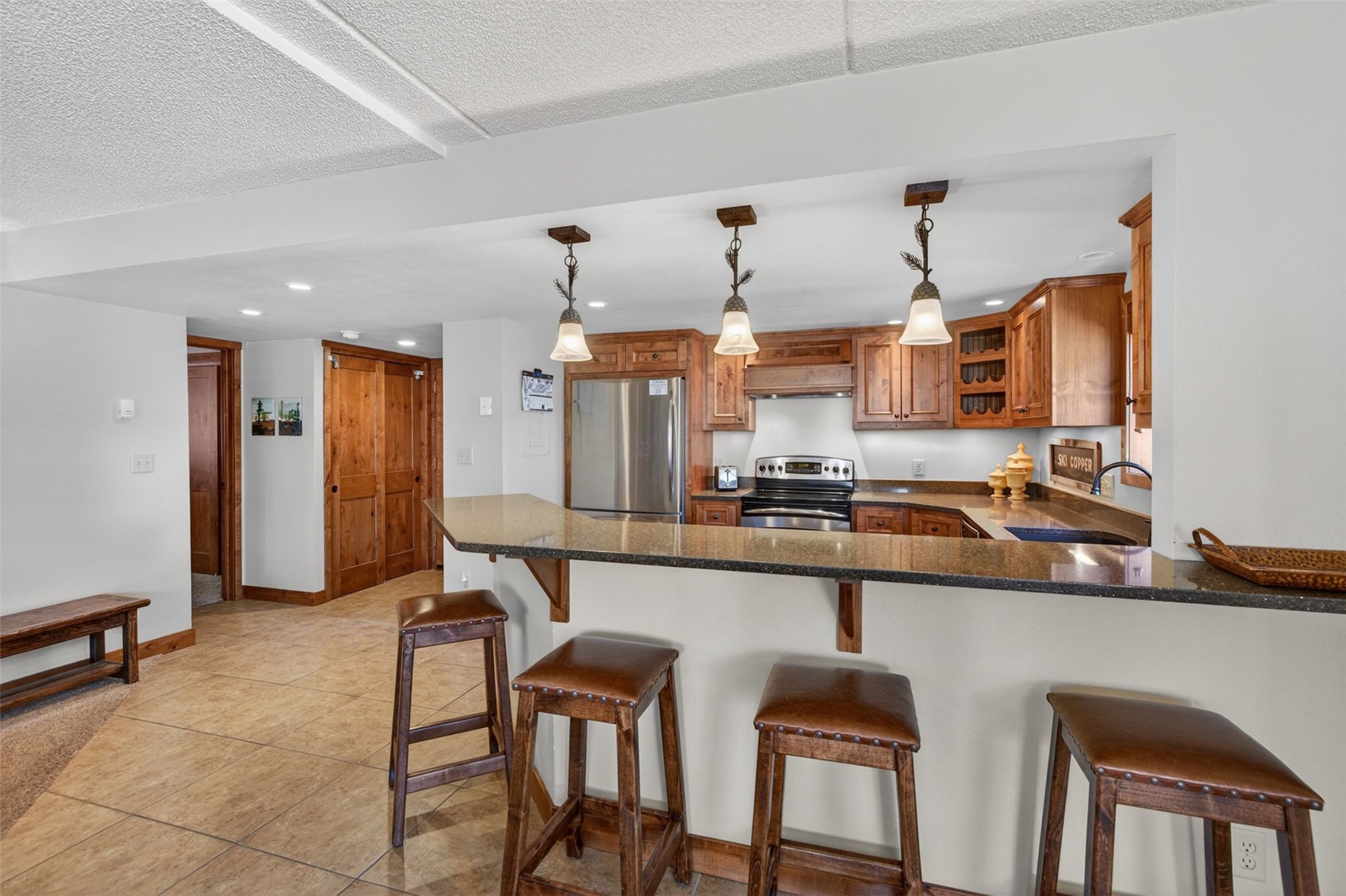 800 Copper Road, Unit 210 Copper Mountain, CO 80443 - Photo 12 of 40 Combined Kitchen Living Dining Room Combo, with updated kitchen and fireplace