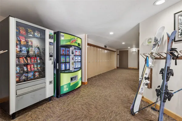 a view of parking garage with cars parked