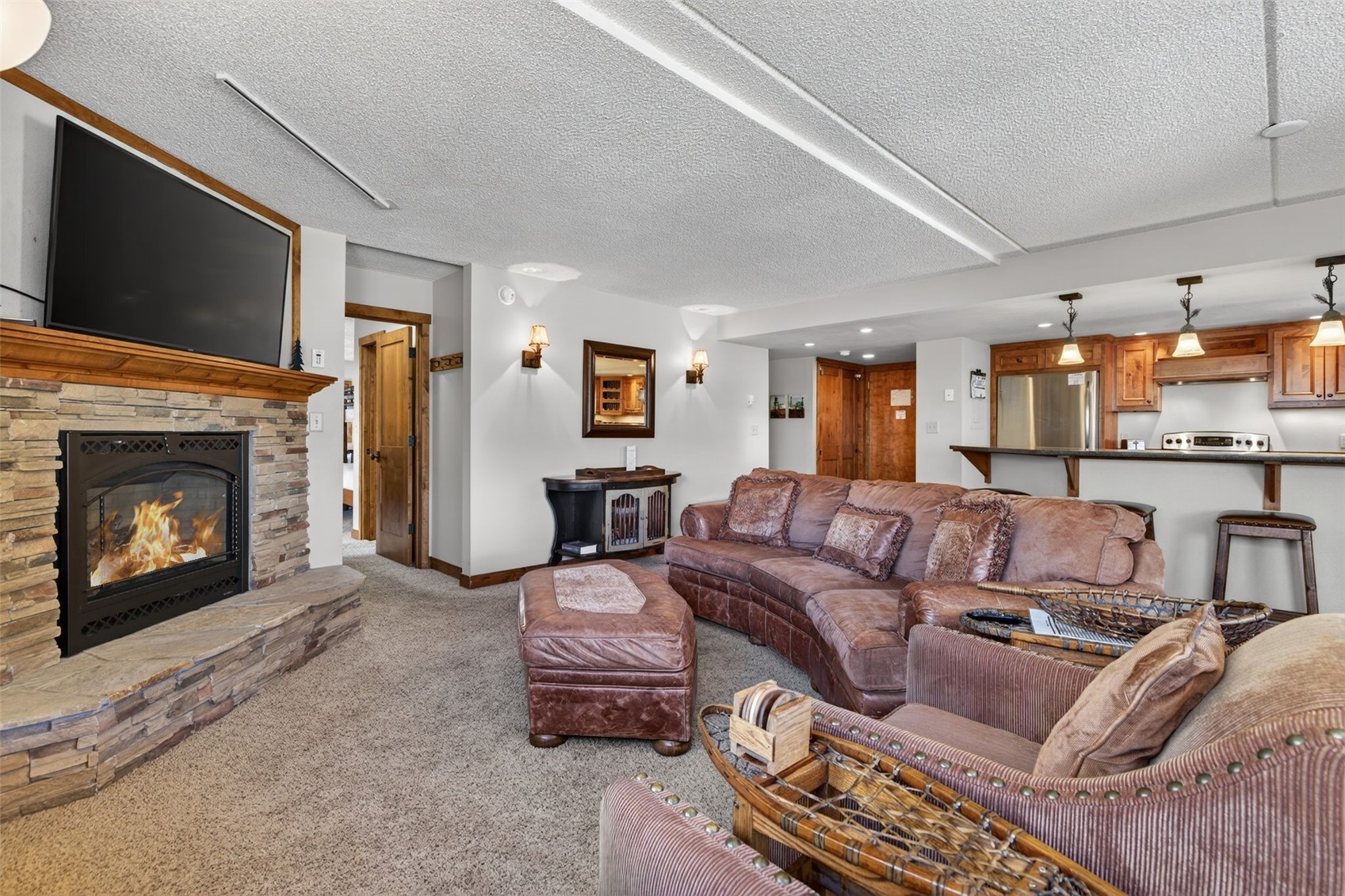 800 Copper Road, Unit 210 Copper Mountain, CO 80443 - Photo 8 of 40 Combined Kitchen Living Dining Room Combo, with updated kitchen and fireplace