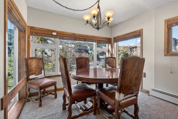 a room with furniture pool table and window