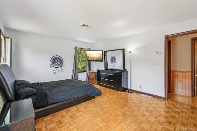 a living room with furniture window and a flat screen tv