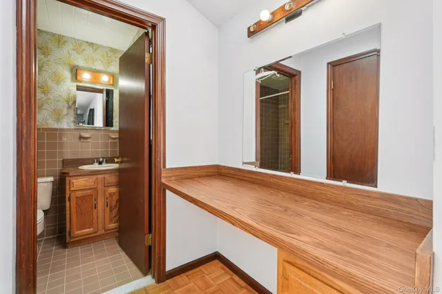 a view of a kitchen from a hallway
