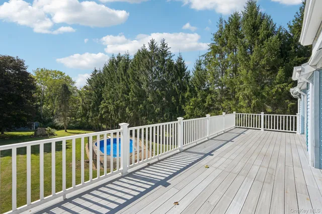 a view of deck with wooden floor and fence