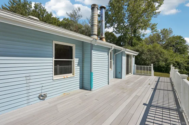 a view of a house with a roof deck