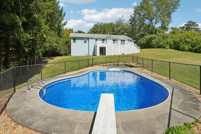a view of a swimming pool with a patio