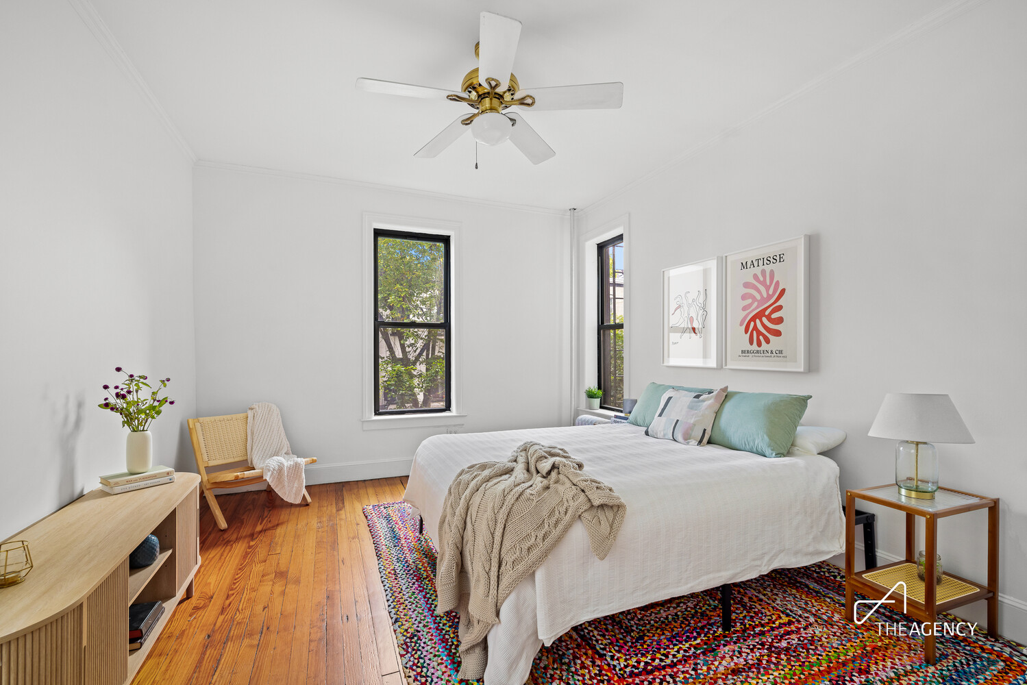 423 15th Street, Unit 2B Brooklyn, NY 11215 - Photo 1 of 10 a bedroom with a bed and wooden floor