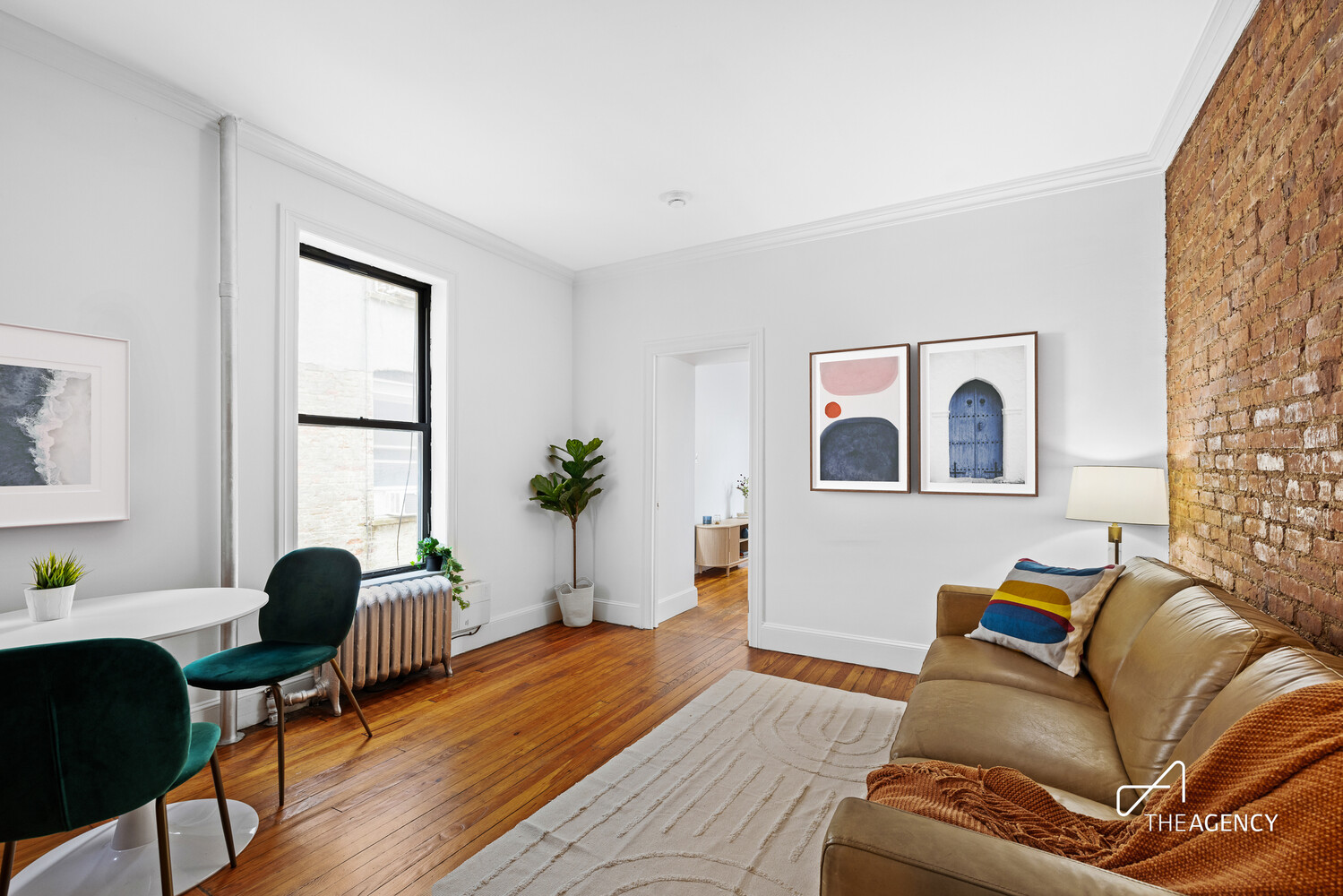 423 15th Street, Unit 2B Brooklyn, NY 11215 - Photo 4 of 10 a living room with furniture and a window