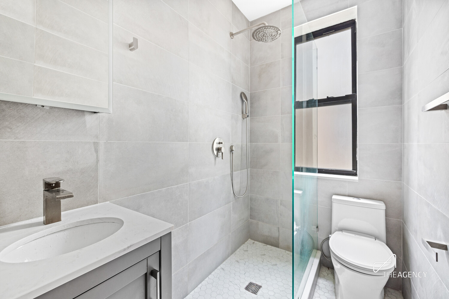 423 15th Street, Unit 2B Brooklyn, NY 11215 - Photo 5 of 10 a bathroom with a sink toilet and shower